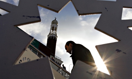 A man arrives for Friday prayers at the central Mosque in Birmingham