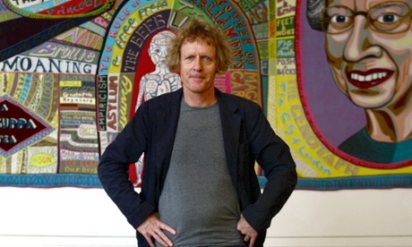 Grayson Perry in front of his tapestry Comfort Blanket at the National Portrait Gallery in London