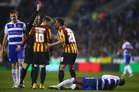 Referee Mike Jones shows the red card to Filipe Morais.