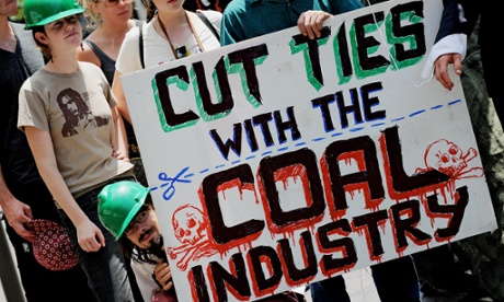 Enviroment activists display an anti-coal industry placard outside the New South Wales Parliament building in Sydney on Novemeber 26, 2009. Australia on November 26 welcomed US President Barack Obama's pledge to slash carbon emissions and attend next month's global climate talks, saying it would 