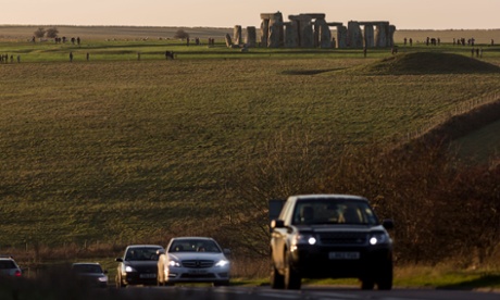 Traffic on the A303 at Stonehenge – plans to build a tunnel to 'reunite' the landscape have divided opinion.