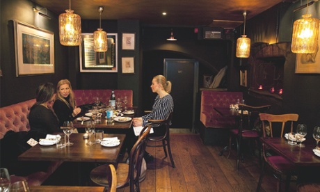 Kitty Fisher’s: ‘Tables, fringed by dusty, pink, buttoned banquettes, are painfully close together.’