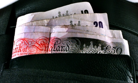 A man with a wad of money in his back pocket.