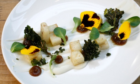 Cubes of roast celeriac with date purée and coconut cream at 1847, garnished with a few flower petals