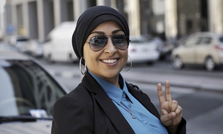 Prominent Bahraini activist Maryam al-Khawaja, daughter of jailed opponent Abdulhadi al-Khawaja, flashes the V-sign for 