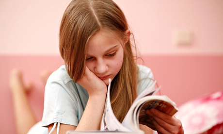 Girl reading book reluctantly