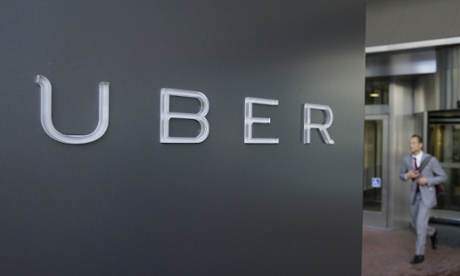 A man leaves the headquarters of Uber in San Francisco.
