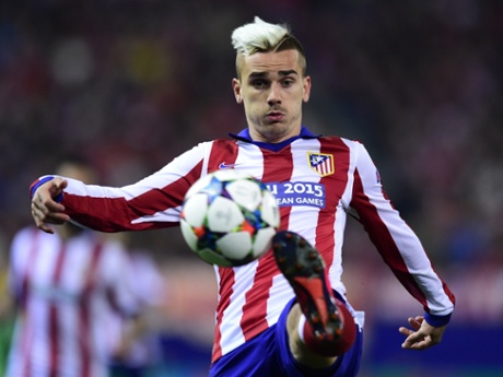 Atletico Madrid's Antoine Griezmann, he of the fancy hair, tries a fancy bit of control as he tries to bring the ball down.