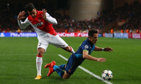 Alexis Sanchez goes to ground under the challenge of Nabil Dirar ...