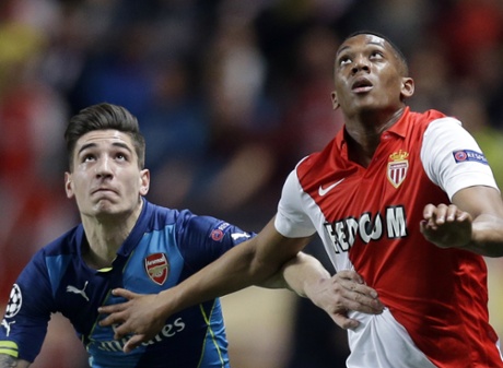 Monaco's Anthony Martial, right, and Arsenal's Hector Bellerin keep their eyes on the ball.