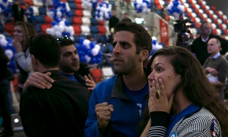 An unclear result: Zionist Union party supporters react after hearing exit poll results in Tel Aviv.