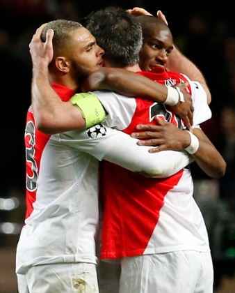 Meanwhile there's a celebratory group hug between Monaco's Layvin Kurzawa, left, Geoffrey Kondogbia, right, and Jeremy Toulalan.