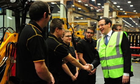 George Osborne meets apprentices during a visit to a JCB factory