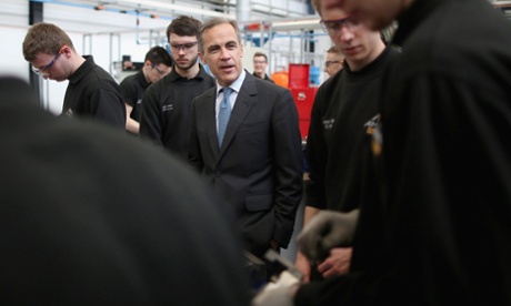 Governor of the Bank of England Mark Carney, centre, speaks with apprentices during his visit to the the University of Sheffield.