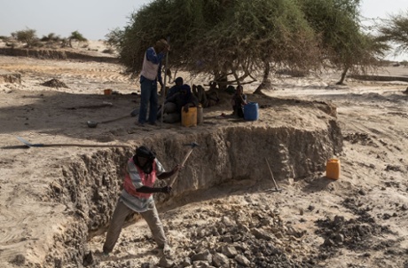 Digging banco, the primary building material for mosques and old buildings in Timbuktu.