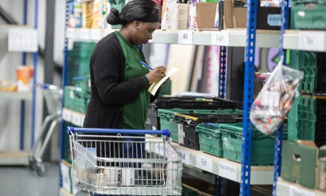 A volunteer prepares parcels at a Trussell Trust food bank in Birmingham.