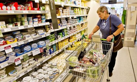 A shopper in a Waitrose store