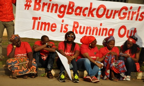 Members of an Abuja protest group wield a banner bearing the #BringBackOurGirls slogan in support of the schoolgirls kidnapped in Nigeria last April. Online hashtag activism can play a key role in supporting women's rights.