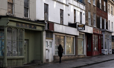 high street with boarded up shops