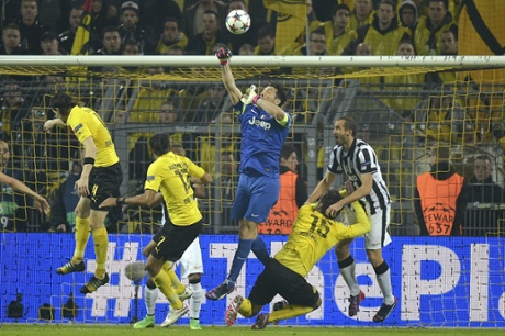 Juventus goalkeeper Gianluigi Buffon punches clear.