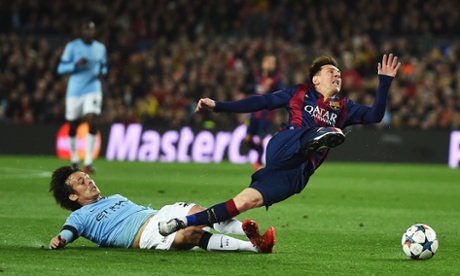 David Silva takes one for the team whilst Lionel Messi takes one on his shin.