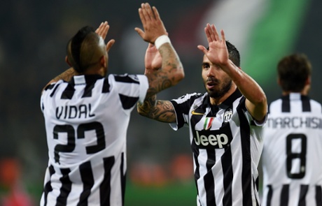 Tevez celebrates with Arturo Vidal.