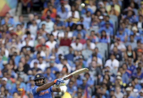 India's batsman Rohit Sharma hits the ball for six.