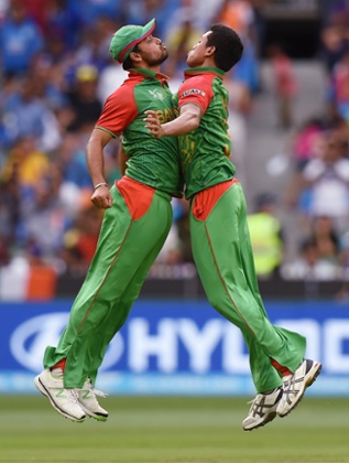 Boom. Another Indian wicket bites the dust. Taskin Ahmed, right, celebrates with his teammate Mashrafe Mortaza after taking the wicket of India's Ajinkya Rahane.
