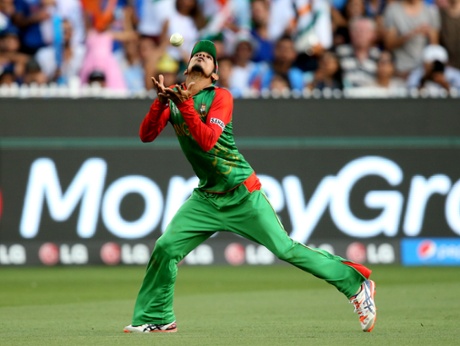 Bangladesh's Nasir Hossain takes a catch to dismiss India's MS Dhoni.