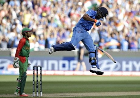 Rohit Sharma celebrates reaching his century.