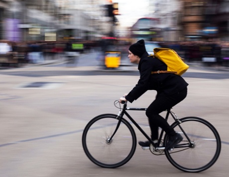Cycling across Oxford Circus.