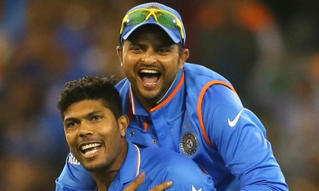 Umesh Yadav of India is congratulated by Suresh Raina during the win over Bangladesh.