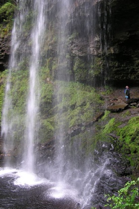 It's possible for visitors to walk behind the waterfall, although it is unlikely they'll find any signs of Batman