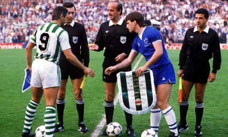 Kevin Ratcliffe and Hans Krankl exchanging pennants before the game.