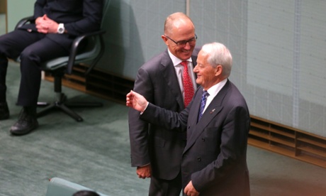 Communications minister Malcolm Turnbull talks with the father of the house and former whip Phillip Ruddock.