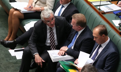 Independent Andrew Wilkie talks to small business minister Bruce Billson during question time.