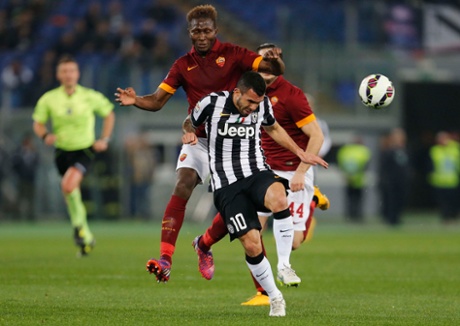 AS Roma's Mapou Yanga Mbiwa challenges Carlos Tevez, still goalless in Rome.