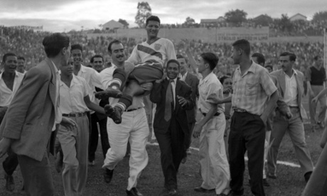 US center forward Joe Gaetjens is carried off by cheering fans after his team beat England 1-0 in the World Cup in Belo Horizonte.