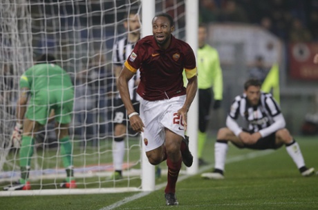 Seydou Keita's goal earns Roma a point but its not enough as the title is almost certainly going to Carlos Tevez's Juventus.