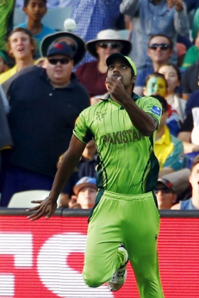 Rahat Ali tosses the ball in the air after catching out  David Warner.