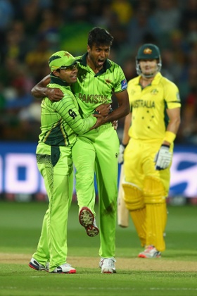 Umar Akmal and Ehsan Adil celebrate taking the wicket of Steve Smith.