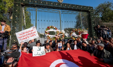 People gather in front of the Bardo museum in Tunis after the terrorist attack which killed 21 people.