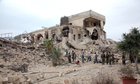 Syrian government forces sift through rubble after a huge explosion in the Carlton Citadel hotel in 2014.