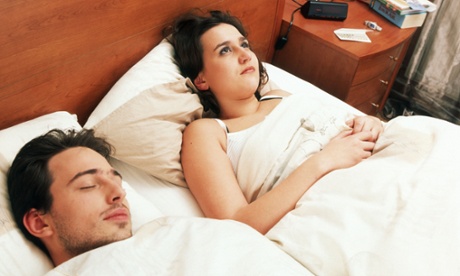 sleeping man worried woman