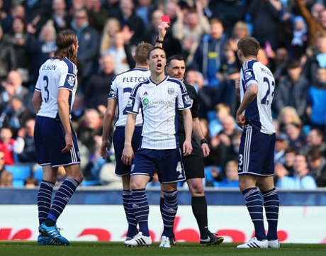 But Referee Neil Swarbrick has got in a tizzy and sends of Gareth McAuley, right, rather than Dawson who committed the initial foul.