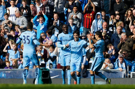 Manchester City's David Silva celebrates scoring their third goal with Eliaquim Mangala, Jesus Navas and Stevan Jovetic.
