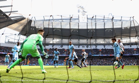 David Silva pokes the ball past Boaz Myhill of West Brom to score Manchester City's third goal.