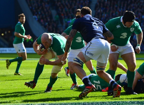Ireland's Paul O'Connell surges towards the line and scores the first try of the match.
