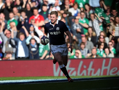 Scotland's Finn Russell goes over to touch down and close the gap.