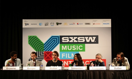 (L-R) Rembert Browne, Nicky Berger, Will Butler, Tatiana Simonian, Paul Krugman, and Win Butler speak onstage at 'The Celebrity Economy In Music' during the 2015 SXSW Music, Film + Interactive Festival at Austin Convention Center.